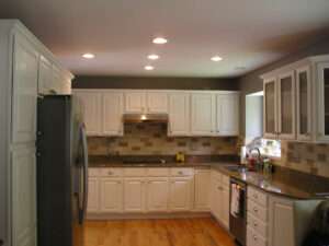 Kitchen cabinets painted off white.